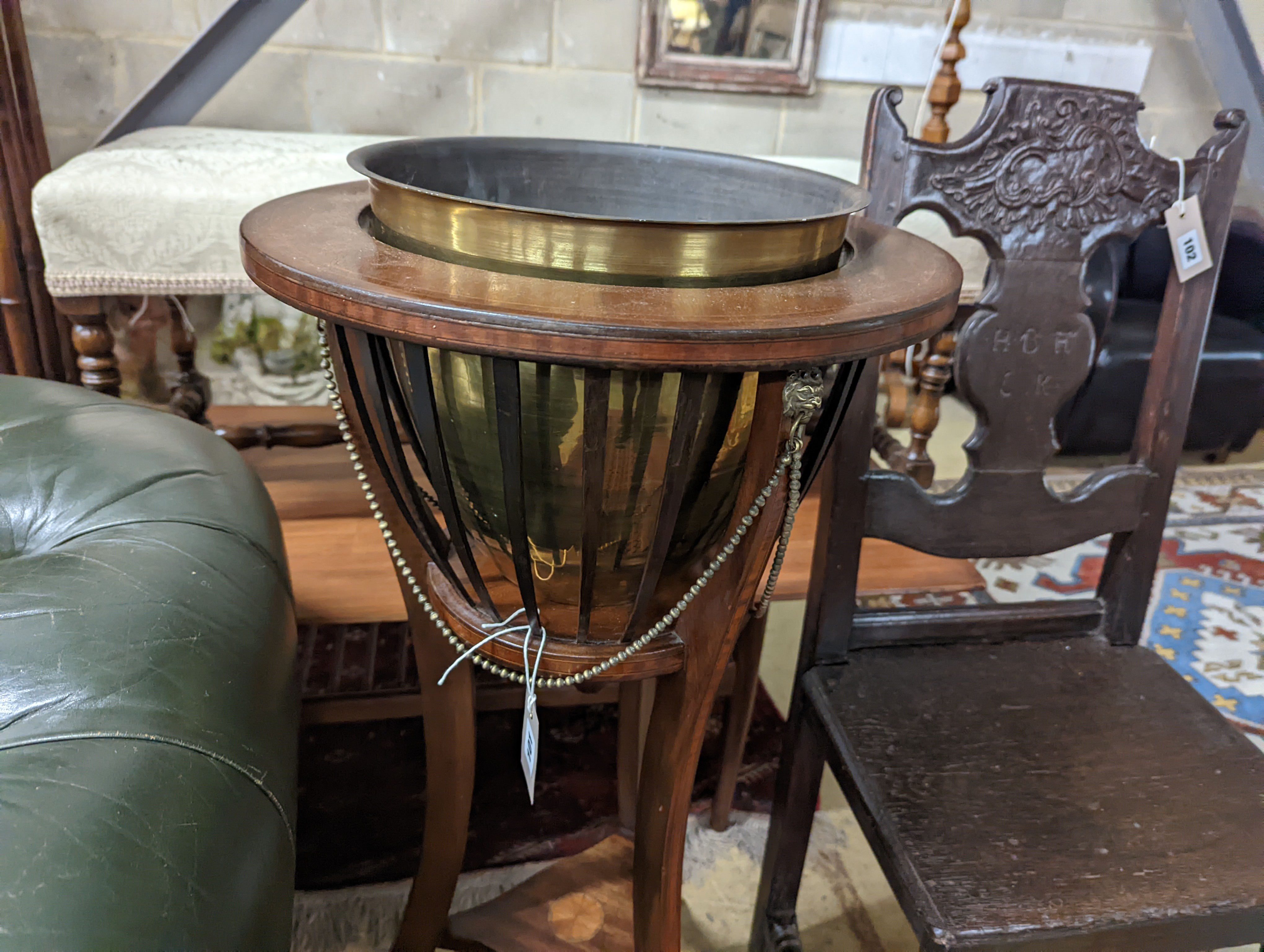 An Edwardian inlaid mahogany jardiniere with associated brass liner, height 92cm